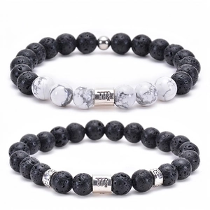 Detail of Virgo zodiac bracelets set with black lava stone and white turquoise beads