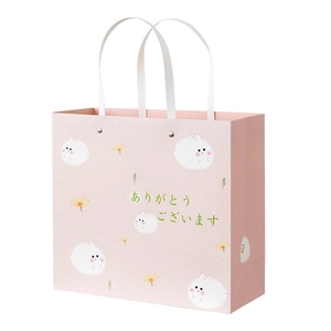 Pink gift bag with cute rabbit illustration and white rope handle for birthdays