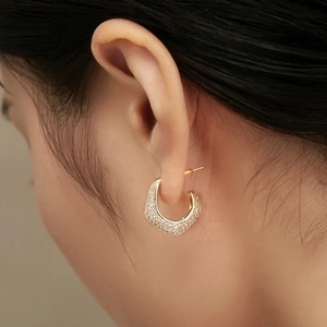 Sparkling gold C-shaped hoop earrings with shimmering cubic zirconia pavé for women