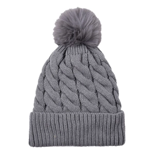 Detailed knit texture of grey acrylic winter hat featuring a fluffy faux fur pompom top