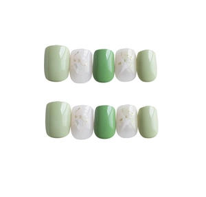 Press-on nails with marble green shell flakes and gold foil accents in glossy finish