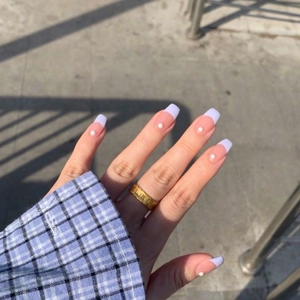 French tip press-on nails in taro purple with pearls and a vintage gold textured ring
