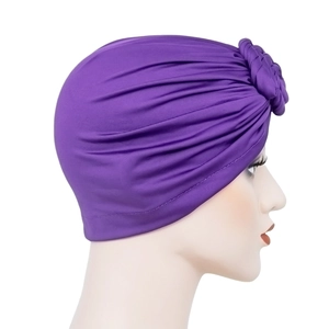 Purple pleated milk silk turban hat for women with elegant donut knot on white background