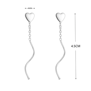 Macro detail of S925 sterling silver heart tassel earrings with 4mm width and 4.5cm length