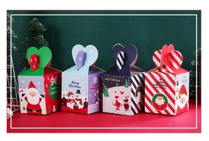 Detailed view of four colorful Christmas Eve gift boxes with festive holiday patterns