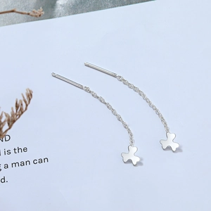 Detail of S925 sterling silver thread earrings with elegant clover petal pendants
