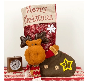 Detailed view of a Christmas stocking with 3D reindeer decor and snowflake patches