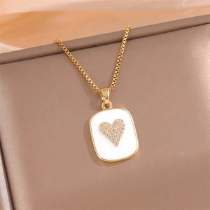 Gold box chain necklace featuring a square white shell pendant with a diamond heart inlay