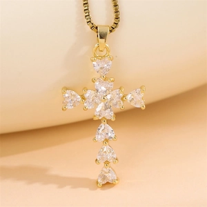 Chic gold cross pendant necklace featuring heart-shaped sparkling crystals for women