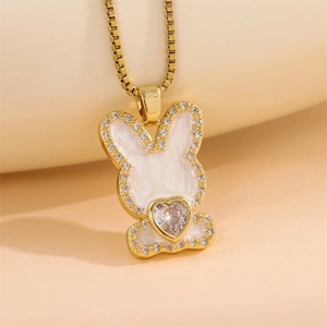 Golden bunny necklace with white enamel and heart-shaped cubic zirconia on box chain