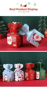 Macro detail of Christmas paper gift boxes with festive reindeer patterns and ribbon closure