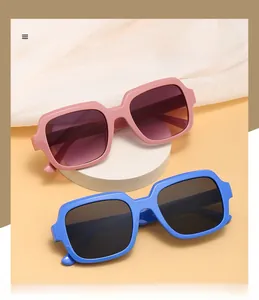 Detail view of pink and blue square oversized sunglasses on white pedestals