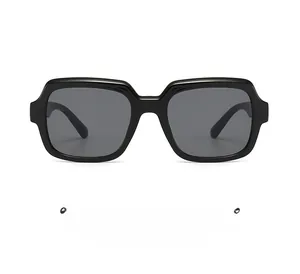 Detail of premium thick black square frame sunglasses with dark grey lenses for sun protection