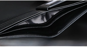 Detailed macro view of black leather wallet interior with card slots and polyester lining