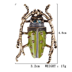 Vintage enamel grasshopper brooch in green and gold with size and weight dimensions