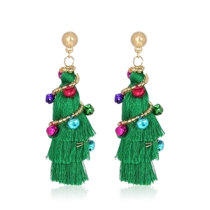 Detailed shot of Christmas tree tassel earrings with festive colorful bells and gold studs