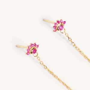 Pink gemstone flower stud earrings with gold chain tassels on a white background