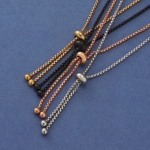Detail showing adjustable slider beads on four-color stainless steel box chains
