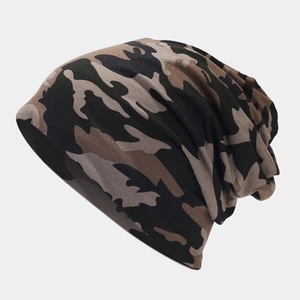 Close-up of camouflage knit beanie featuring jungle patterns and elastic texture
