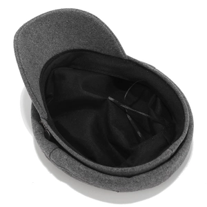 Grey wool blend newsboy cap with stylish side chain detail on a white background