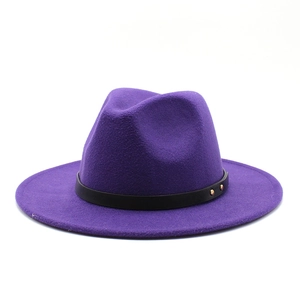 Detail of purple wool fedora hat featuring a black leather belt with gold studs decoration