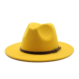 Detail of yellow wool felt fedora featuring a dark brown leather band and bronze metal buckle