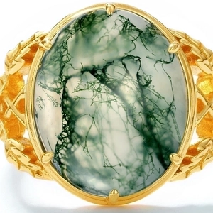 Macro shot of oval green moss agate stone with intricate leaf patterns on golden ring band