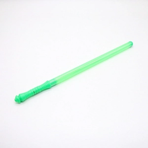 Detail of green plastic light sword toy with textured handle for concert cheering