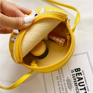 Cute yellow daisy crossbody bag for girls showing compact interior storage space