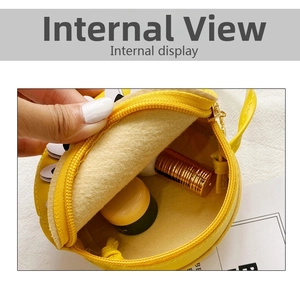 Internal display of yellow round kids bag showing storage capacity and soft lining