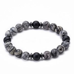Close-up of 8mm grey marble beads and black lava stones with silver metal spacers