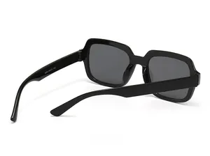 Detail view of square black sunglasses showing model 5408 and size 54-18-143 on inner arm