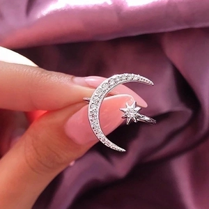 Adjustable silver crescent moon and star ring with sparkling cubic zirconia stones