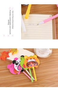 Detail of cute cartoon fan pens writing on paper with multiple character designs