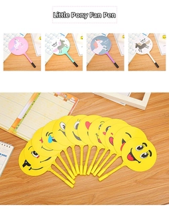 Detail showing cartoon unicorn and emoji fan pens with functional ballpoint tips