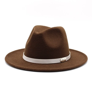 Detail of dark brown wool Fedora hat featuring a white leather band and silver metal buckle