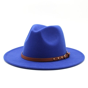 Detail of royal blue fedora hat featuring a brown leather band with gold metal studs