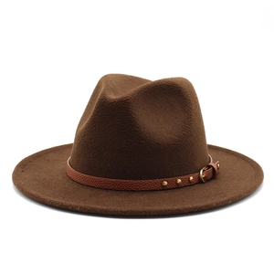Detail of the brown wool fedora hat featuring a leather band with gold metal rivets