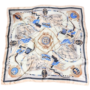 Flat lay of 90x90cm nautical satin scarf with sailing boats and anchor patterns