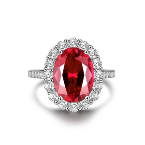 Luxurious S925 silver ring featuring a large oval red gemstone and zircon accents