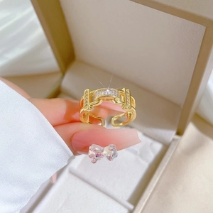 Adjustable gold chain ring with rectangular zircon in a luxury jewelry gift box