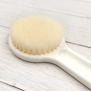 Pearl white bath brush with dense soft bristles and ergonomic long handle for body cleaning