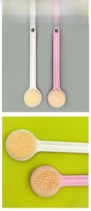 Detail showing the long handle bath brush head and hanging hole in white and pink