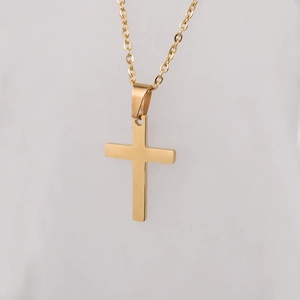 Minimalist gold cross pendant necklace with polished mirror finish and fine metal chain