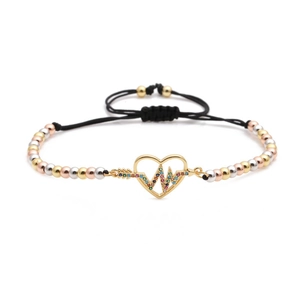 Detail of adjustable woven bracelet featuring tricolor beads and zircon heart pendant
