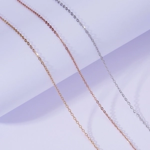 Detail of 18k gold, rose gold and silver stainless steel minimalist chain necklaces