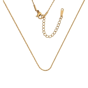 Close-up of 18k gold plated stainless steel chain with lobster clasp and extension link