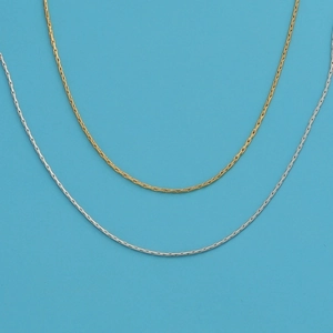 18k gold and silver plated stainless steel snake chain necklaces on blue background