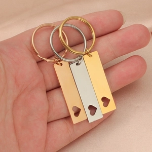 Polished stainless steel rectangular keychains with heart cutout in gold, silver, and rose gold