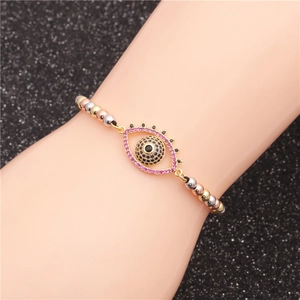 Colorful beaded bracelet with evil eye charm in gold, silver, and rose gold finish